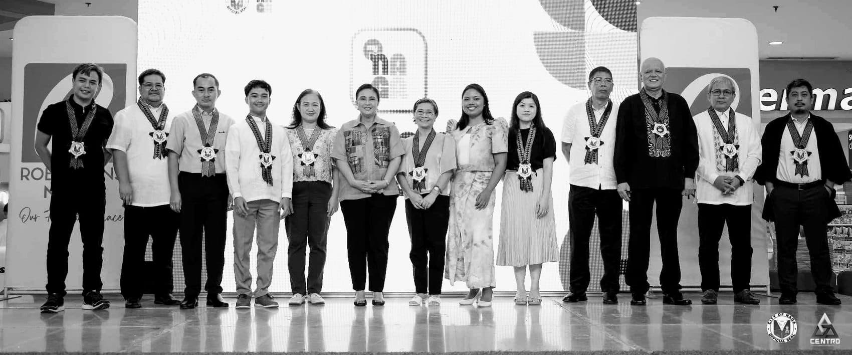 Members of the Advanced Naga for Innovation and Good Governance (ANINAG) Council on stage at a Naga City convening, with Prof. Voxstra Corbett among them